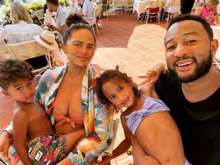 
Chrissy Teigen and John Legend Pose for Family Selfie with Santa and Mrs. Claus: ‘Big Win for Us’ 
